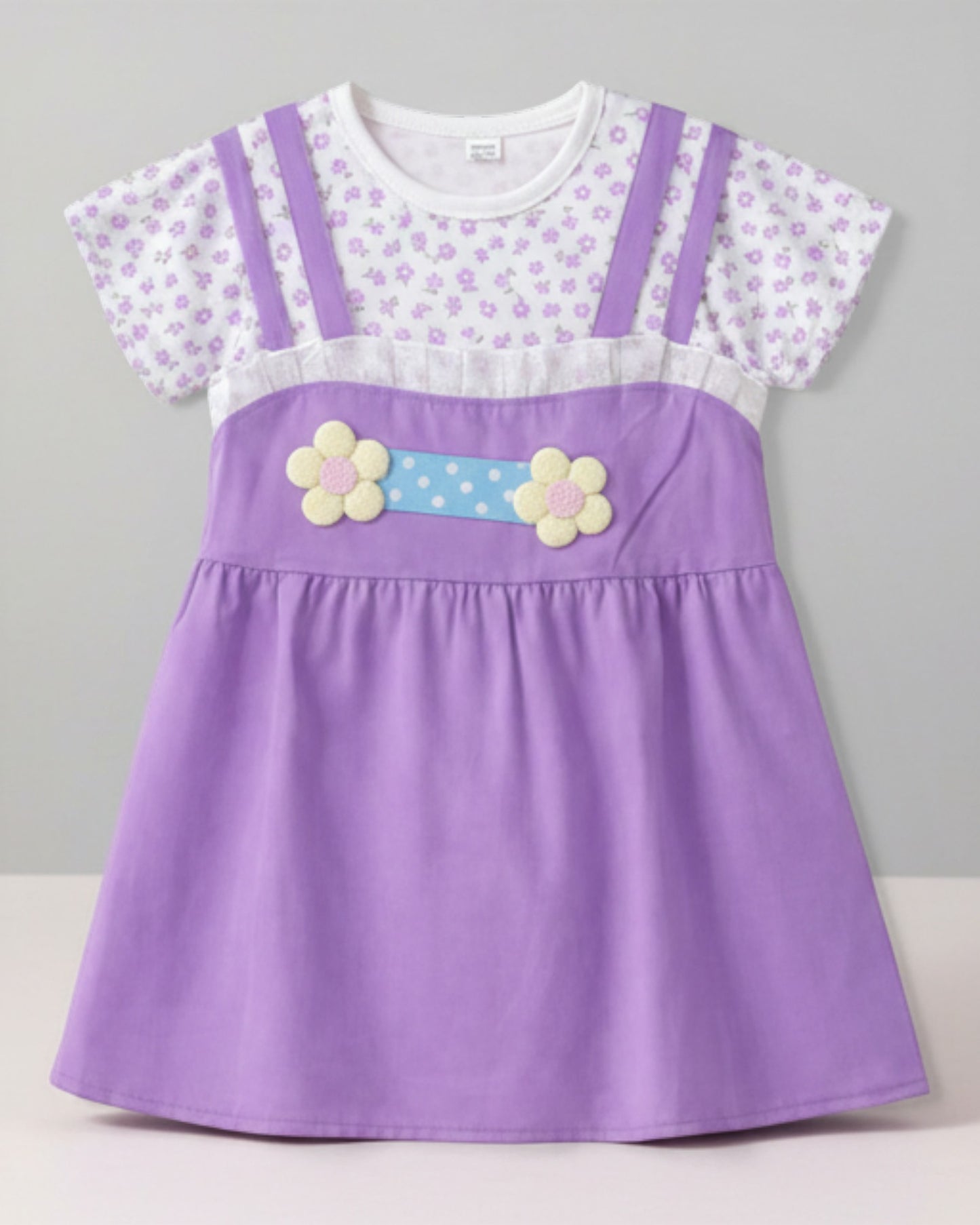 Little Roots baby girl's purple attached frock with floral print top, 3D flower belt, and pleated neckline. Lightweight summer dress.