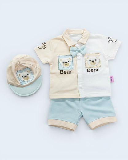 Little Roots baby boy 3-piece outfit set with bear design, bow tie, shorts, and cap. Cream and white color block shirt with blue accents.