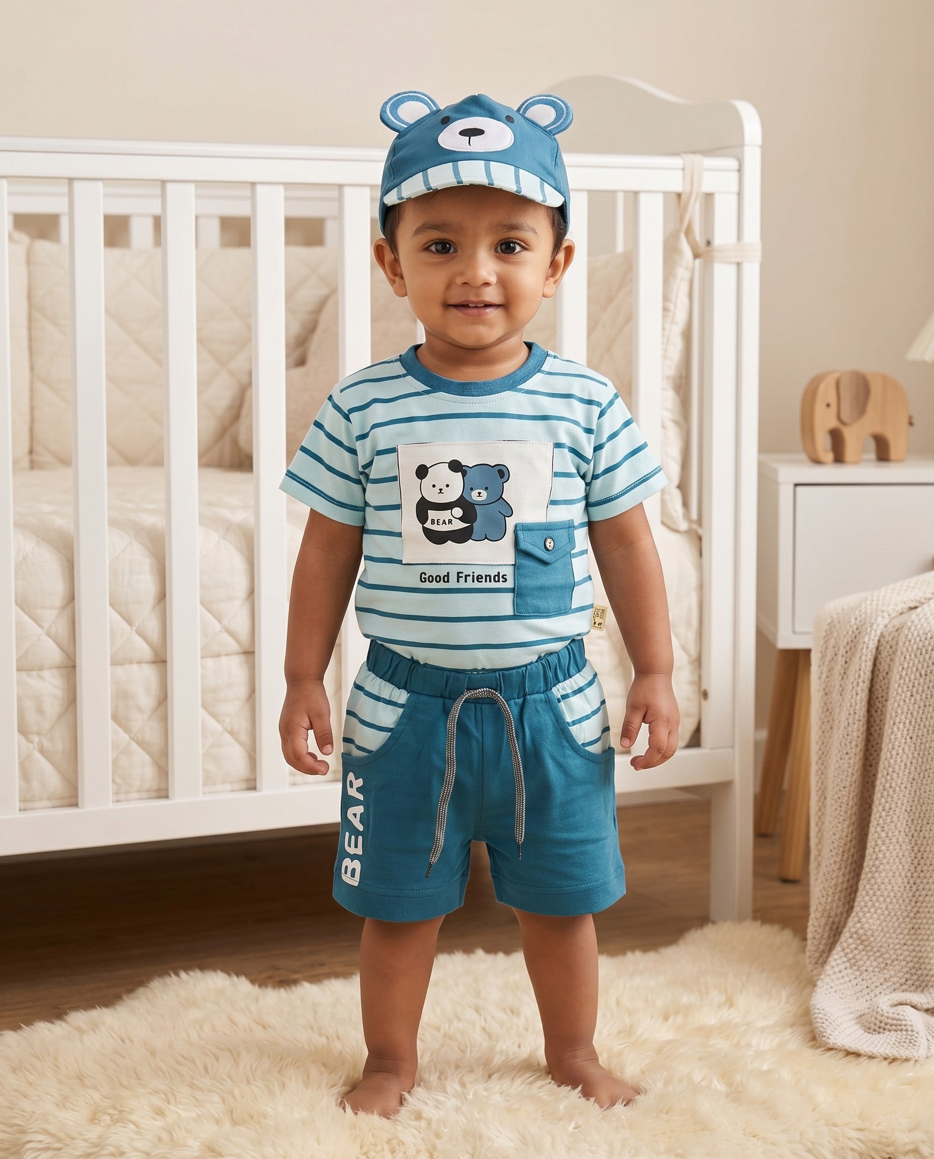 Little Roots baby boy blue striped t-shirt, shorts, and bear face cap set with 'Good Friends' graphic.