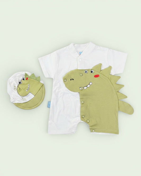 Little Roots baby boy white cotton romper with a green dinosaur applique and matching cap. Short sleeves, snap closure.