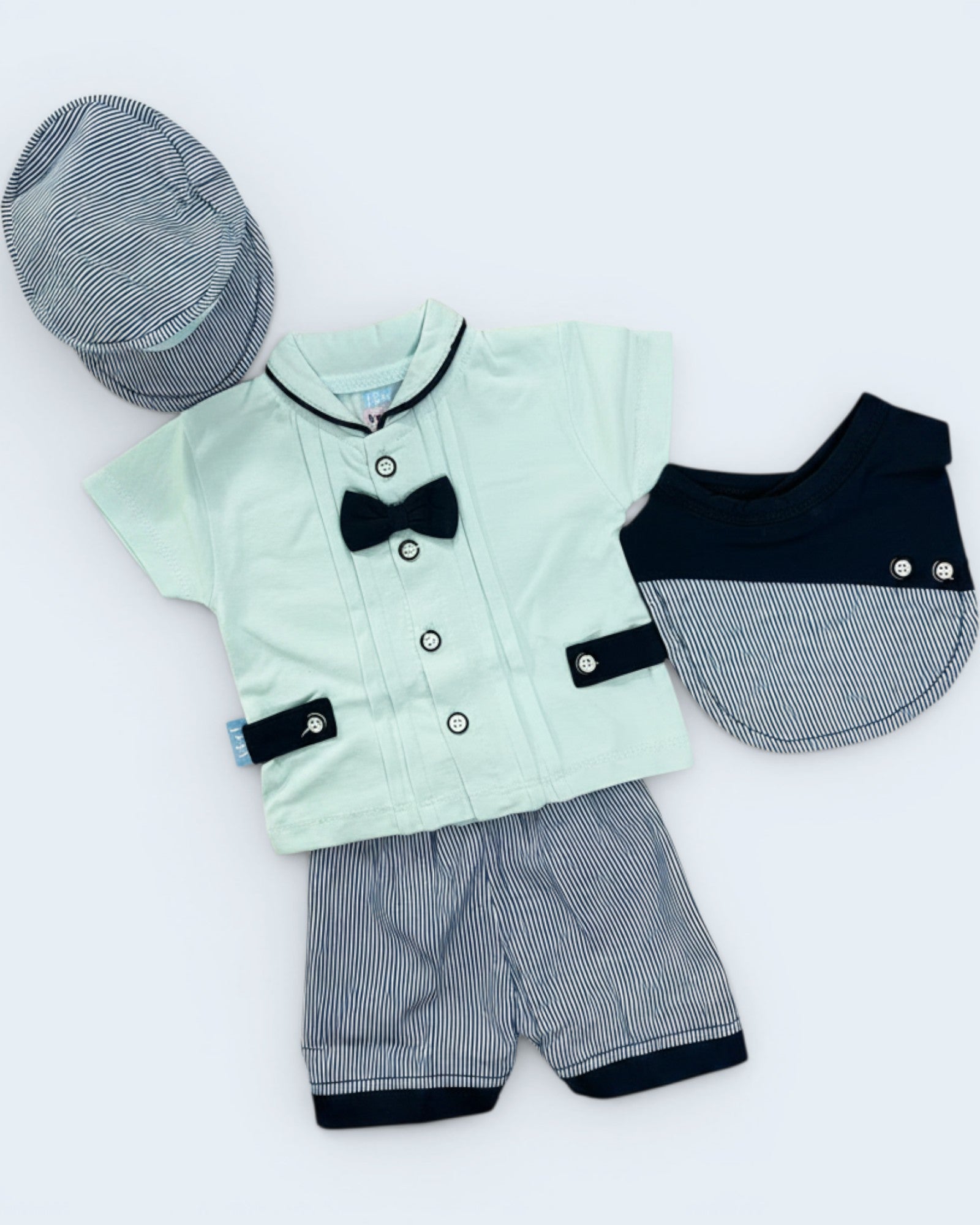 Little Roots Pakistan baby boy 4-piece formal outfit set in mint green with black bow tie, striped shorts, cap, and bib.