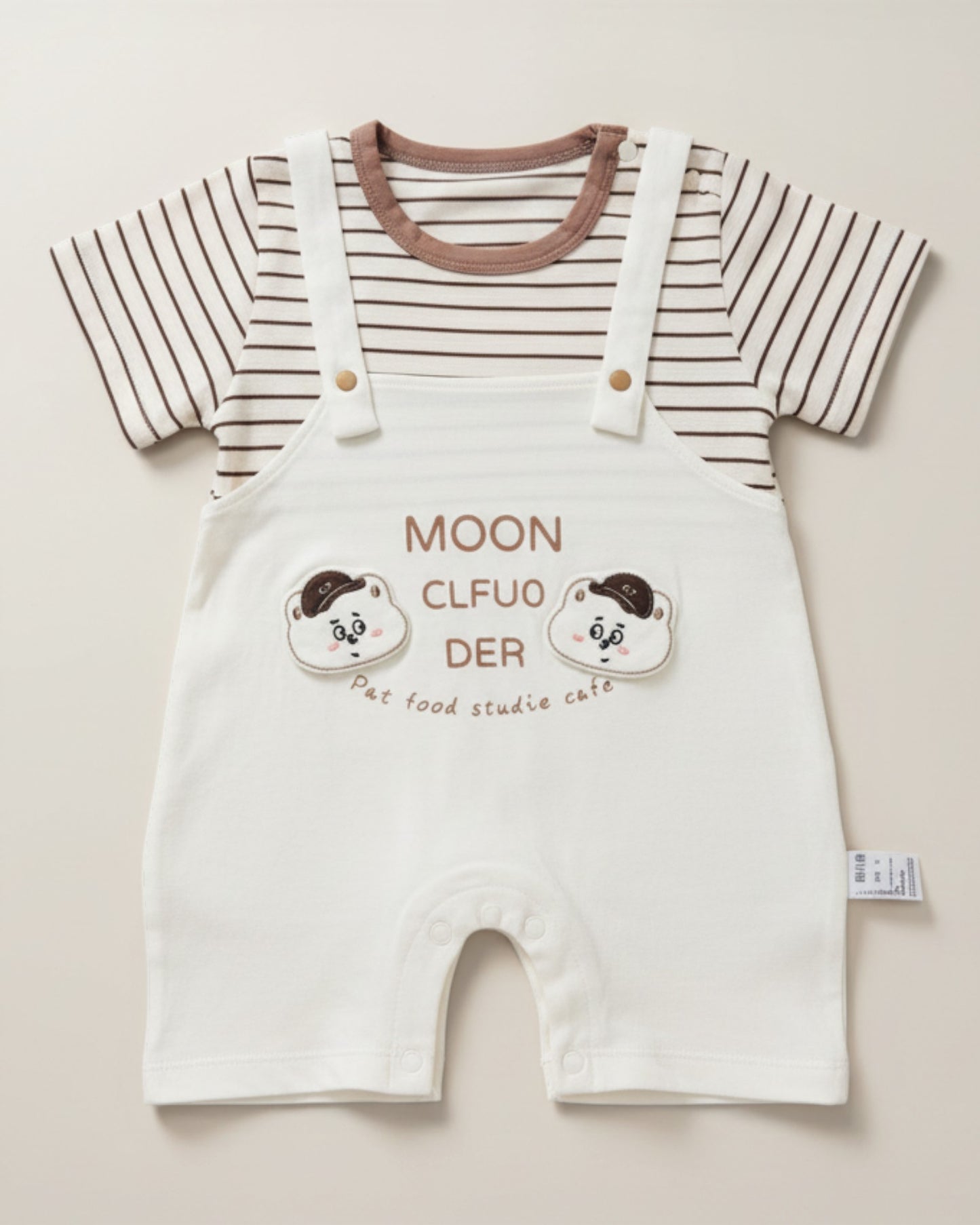 Little Roots baby boy cream romper set with brown stripe t-shirt, attached suspenders, and bear cartoon print. Cotton blend.