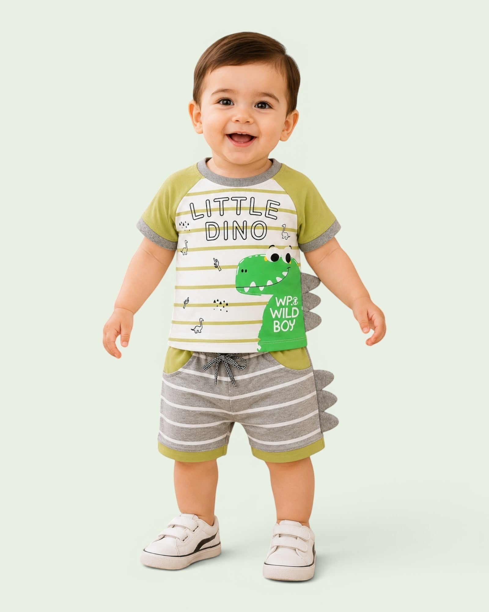 Little Roots baby boy green and white striped dino t-shirt with grey striped shorts and 3D spikes.
