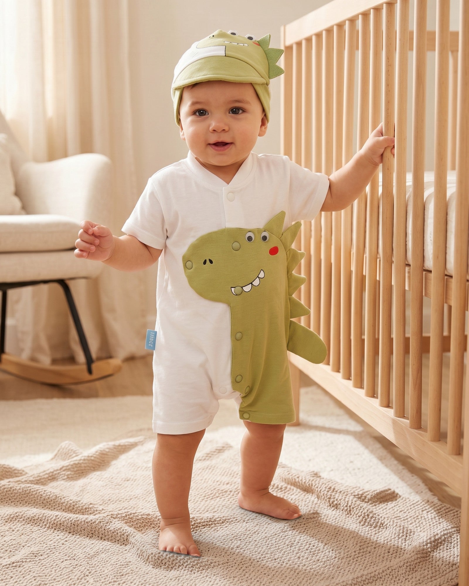 Little Roots baby boy white and green dinosaur romper with matching cap, 0-3 months, soft cotton blend.