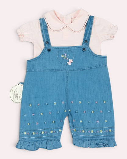 Little Roots baby girl pink puff sleeve top with a blue denim embroidered romper featuring floral details and ruffle hems.