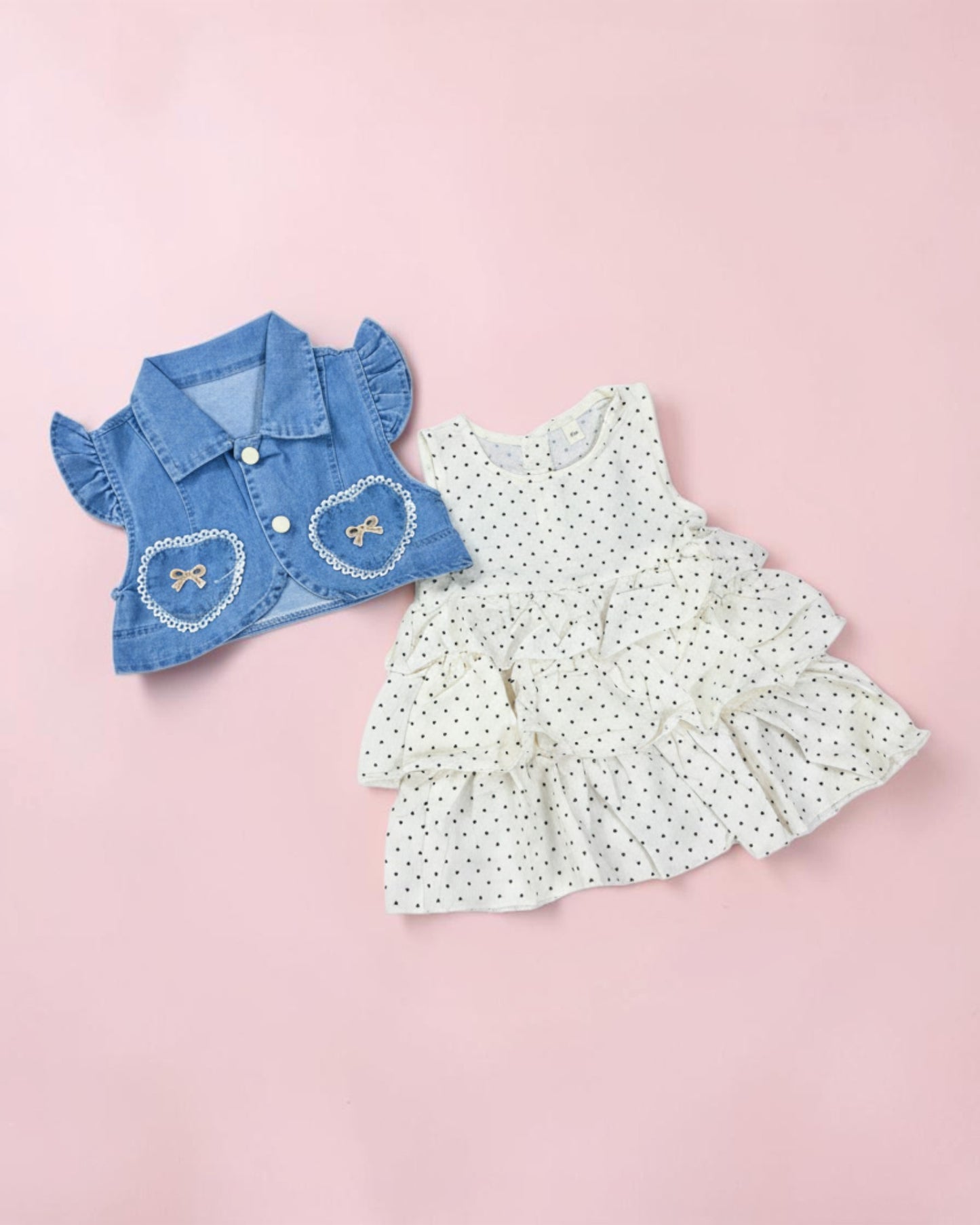 Little Roots baby girl white frill frock with black hearts and blue denim vest with bow details.