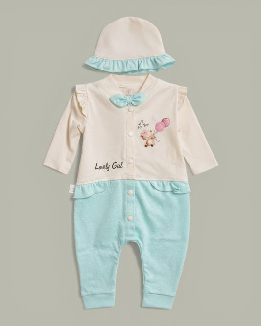 Little Roots baby girl romper and cap set in cream and mint green with polka dots, featuring a teddy bear print and ruffles.