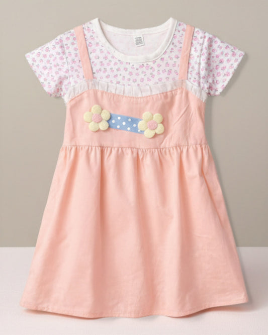 Little Roots peach baby girl's summer dress with floral print top and 3D flower applique on a polka dot belt.