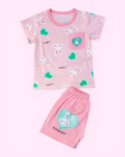 Little Roots baby girl pink cotton set with rabbit and heart print, featuring a pocket detail and elastic waist shorts.